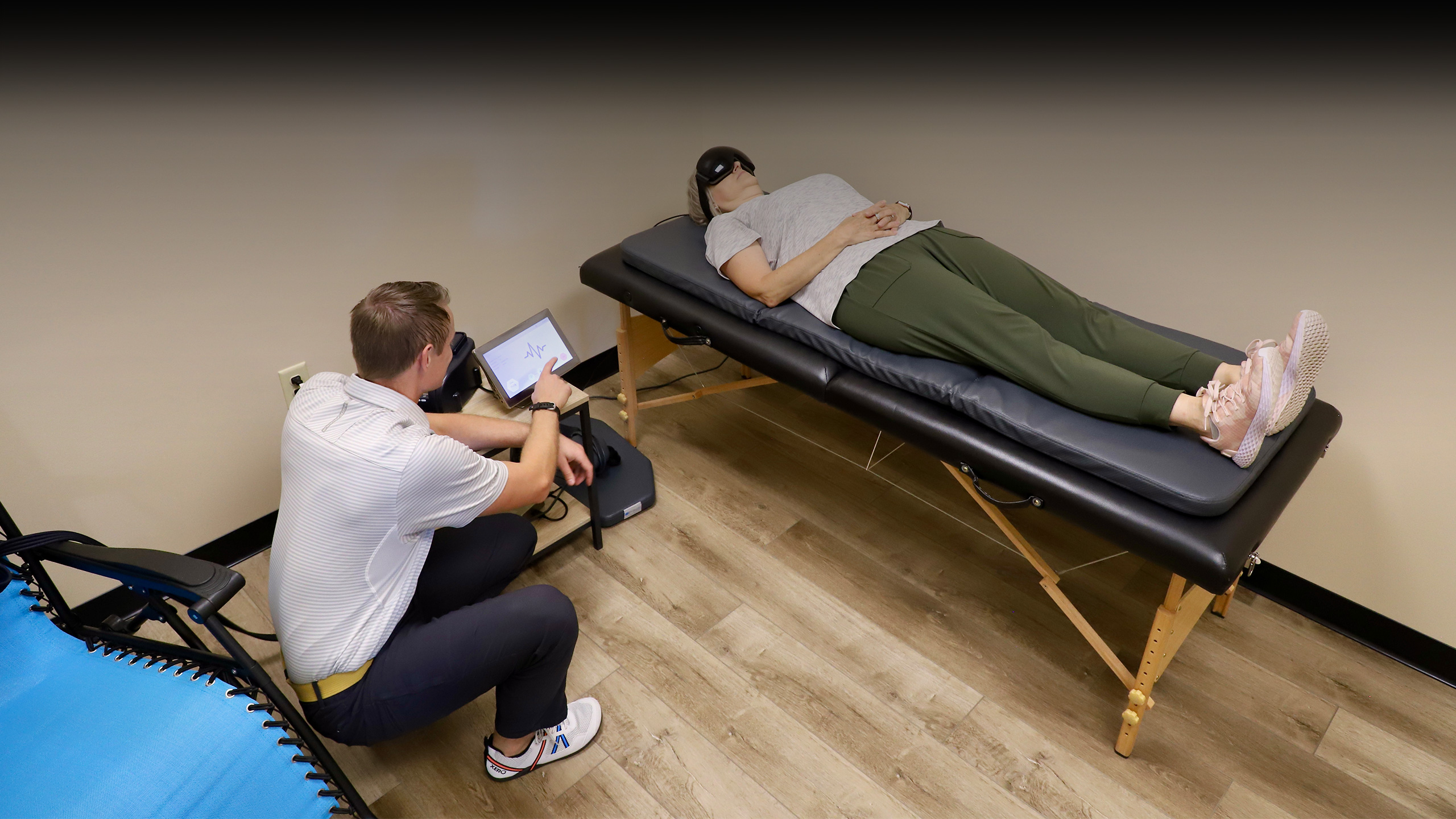 Dr Keith Sparks working with physical rehabilitation patient