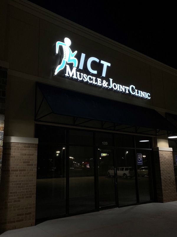 ICT Muscle & Joint Clinic illuminated sign at night