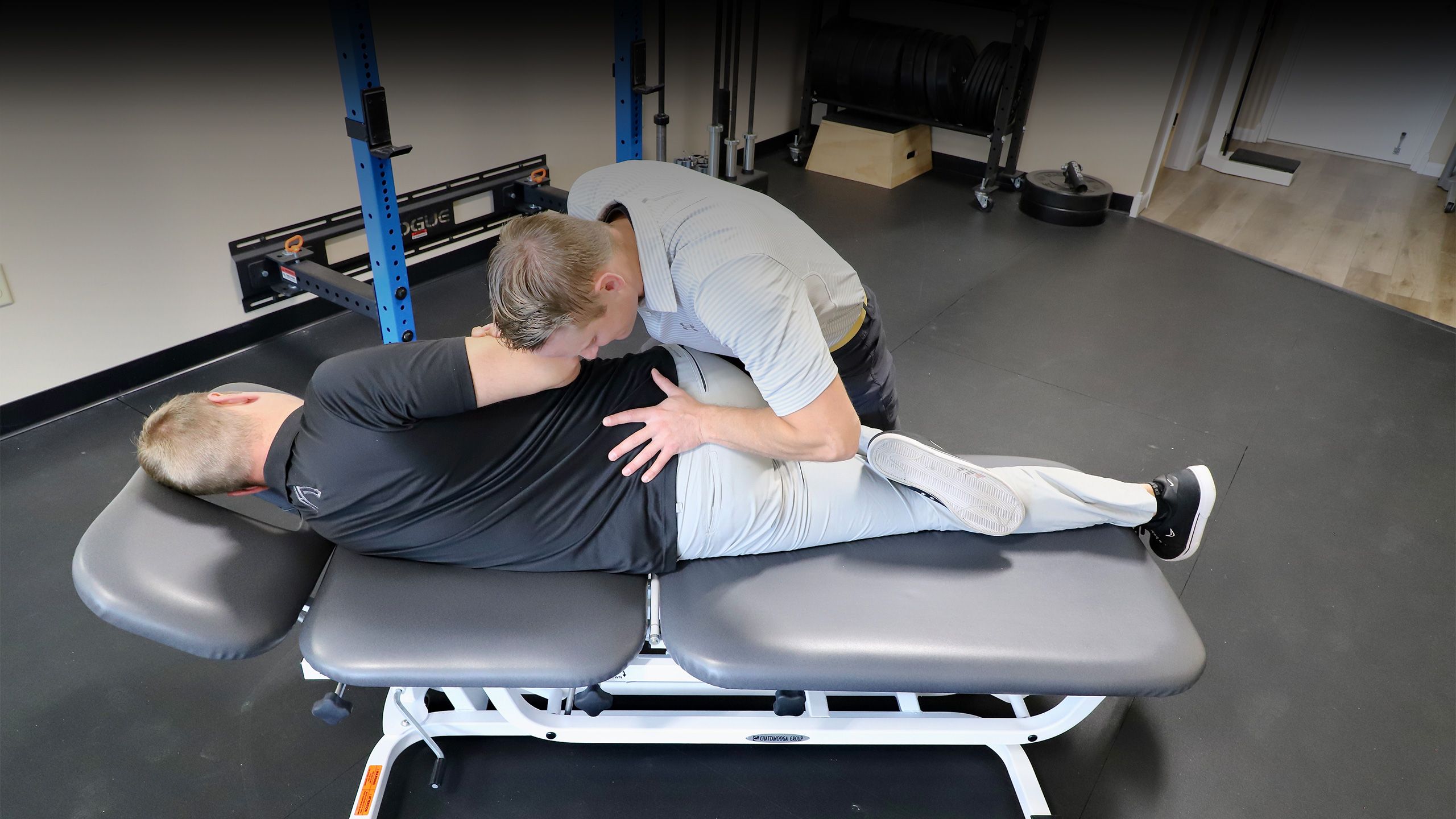 dr keith sparks performing chiropractic adjustment on lower back