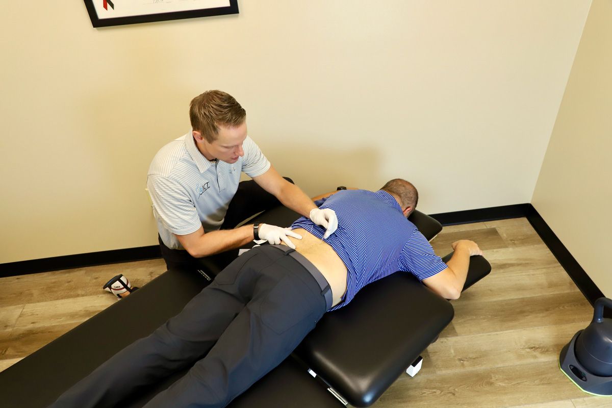 chiropractor administering dry needling therapy